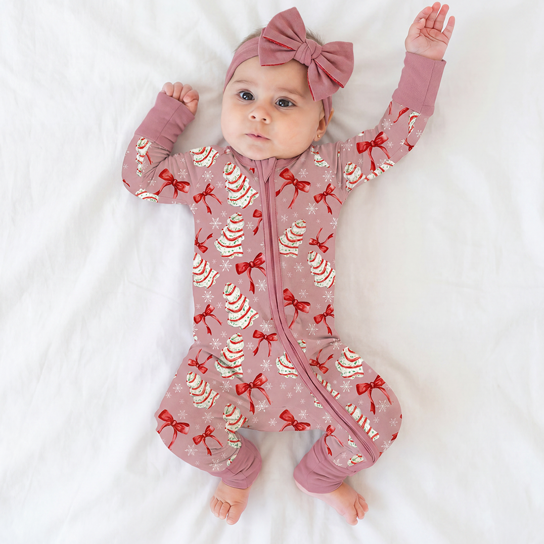 Baby wearing lightweight summer bamboo zip romper pajamas with cowboys horses print pattern